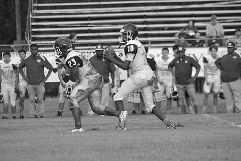 Mamou quarterback Dezmond Skinner (10) drops back for a pass in the jamboree. He threw for 189 yards and 3 touchdowns in the Green Demons’ 32-22 win over E. Beauregard  (Gazette photo by Sylis Manuel)