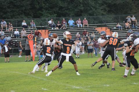 Branson Fontenot (8) delivers a pass in Pine Prairie’s 49-16 win over Merryville earlier this season. The Panther quarterback went 12 for 15 with 312 yards and five touchdowns in the team’s first win in two seasons and went on to be named as a member of the All-District first team. (Gazette photo by Rhett Manuel)