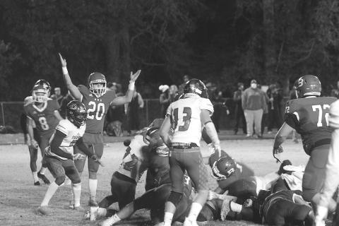 Basile’s Justin Smith (20) celebrates as Ethan Bazinet crosses the goal line for a touchdown in the Bearcats’ season ending loss to Logansport in the quarterfinals. (Gazette photo by Tony Marks)