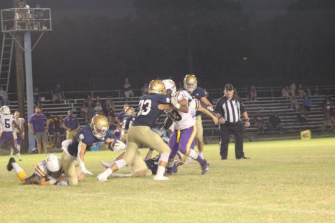 Sacred Heart’s Caleb Hood (3) dives forward for extra yardage after being tackled by a Marksville Tiger last week. Hood and the rest of the Trojans earned a win this week over parish rival Basile. (Gazette photo by Rhett Manuel)