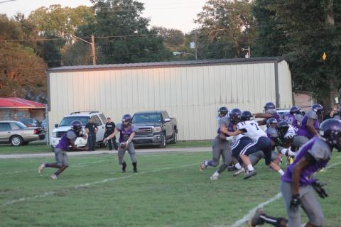 Ja’Keelan Bruno (2) takes a handoff from quarterback Michael Berry in a Ville Platte High football game played earlier this season. The Bulldogs now host Mamou in the first district contest for both squads. (Gazette photo by Rhett Manuel)