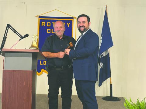 PASSING THE GAVEL - Outgoing president Bob Manuel (left) presented the president’s meeting gavel to newly-installed president Beau Wilson.