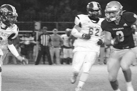 Briggs Ardoin (3) runs toward a Ville Platte High rusher as he looks to make a tackle for Sacred Heart in the Tee Cotton Bowl. Ardoin and the rest of the Trojans now take their show on the road for the second consecutive week. (Gazette photo by Rhett Manuel)
