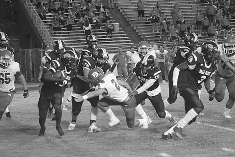 Ville Platte’s Montagon Dixon (13) avoids a tackle from Basile’s Jackson Courville (2) in the Bulldogs’ 35-20 home loss to the Bearcats last season. (Gazette photo by Rhett Manuel)