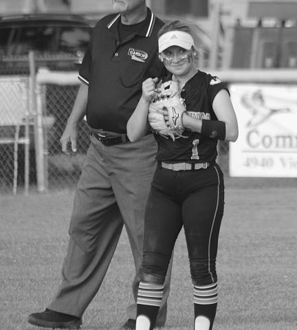 Victoria Briscoe (1) gives a fist bump to a Pine Prairie teammate after making a play at shortstop. (Gazette photo by Rhett Manuel)