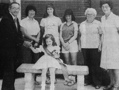 MAYOR BUYS POPPY - Ville Platte Mayor Hottell Fontenot (left) purchased the first poppy from Poppy Queen Ashli Prejean during the annual poppy sale sponsored by the American Legion. Also shown, from left next to Fontenot are members of the American Legion Ladies Auxiliary who sold the poppies at several shopping centers around Ville Platte. They are Rosie Guillory, Lynette DeBaillon, Cherie DeBaillon, Jeanette Perron and Iris LaTour. (Gazette archive photo)