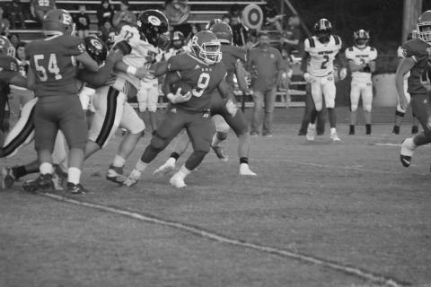 Basile’s Horace Edwards (9) finds real estate to gain in a game earlier this season against Gueydan. (Gazette photo by Rhett Manuel)