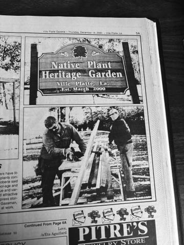 New signage was installed at the native Plant Heritage Garden (shown on top) in December 2000, along with an Acadian architecture-style storage shed. The shed was constructed by groundskeepers Bob Gassman, Donald Reinert and Billy Rose (shown being worked on in the bottom photo).  (Gazette archive photos)