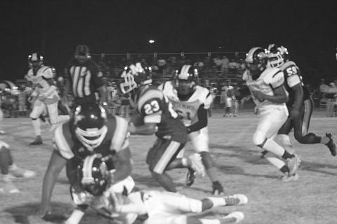 Sheamus Frank (23) gains yardage for his Mamou Green Demons against Ville Platte High. In the game, Frank went on to score his first touchdown of the season on his team’s way to a 36-31 win on homecoming night. (Gazette photo by Sylis Manuel)