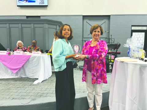 Sarahi Sawtelle (left) was the recipient of the Women With Heart Award for Evangeline Parish. In the above photo, she is presented her award by Sonia Ardoin (right). (Gazette photo by Heather Bogard)