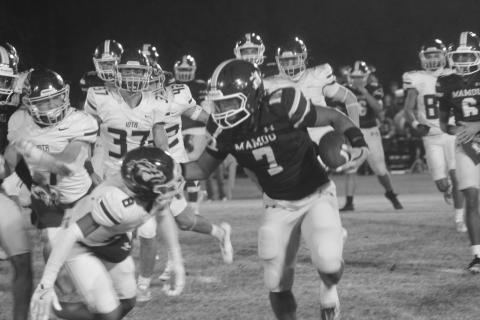 Keontez Campbell (7) looks to avoid a tackle from an Iota defender as Mamou lost 48-0 on Halloween night. The Green Demons (3-6) end the regular season tomorrow night at Pine Prairie against the Panthers. (Gazette photo by Tony Marks)