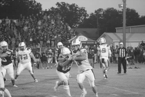 Pine Prairie’s Caden Askey (6) is pictured as he gains 14 yards in the first quarter. His run helped set up a Panther touchdown to begin the second quarter against the Iota Bulldogs. (Gazette photo by Tony Marks)