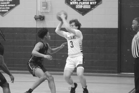 Gabe Fontenot (3) looks to pass the basketball to a Sacred Heart teammate while being defended by a J.S. Clark player. (Gazette photo by Tony Marks)