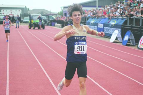 Jackson Soileau, of Sacred Heart, is pictured just before he crosses the finish line at the LHSAA State Cross Country Meet. He placed third in Division IV Boys with a time of 16:14.95. (LSN photo by Tony Marks)