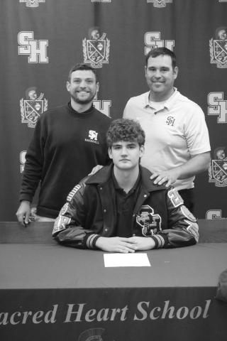 Pictured from left (standing) are Sacred Heart assistant coach Kayne Hargrave and head coach Gary Ashworth and (seated) Jackson Bruney. (Gazette photo by Tony Marks)