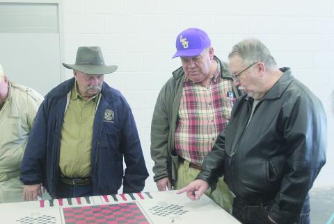 From left are Ville Platte Rotarians Bob Manuel, Steve Phillips, and Dan Poret as they inspect a game table in one of the cell blocks located inside the new Evangeline Parish jail. The new jail is nearing completion and is located inside the Industrial Park. (Gazette photo by Tony Marks)