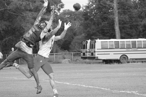 Ville Platte High’s Greg Guillory (5) breaks up a pass intended for Basile’s Parker Fontenot (6) in the Bulldogs’ 6-0 in the Evangeline Parish Jamboree at Pine Prairie Friday night. (Gazette photo by Sylis Manuel)
