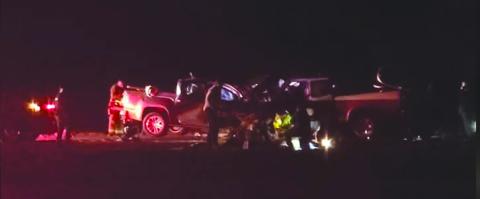 NEW YEAR’S ACCIDENT - Only flashlights and headlights show the results of  the January 1  head-on collision on Highway 190 just east of the Basile town limits.