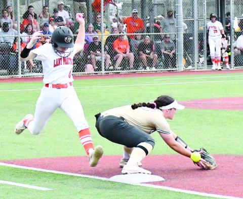 Macy (M.J.) Chauvin (8) legs out a single in Pine Prairie’s 3-2 loss to Jena in the softball state semifinal game. She had two of her team’s four hits. (Photo by Craig Franklin)