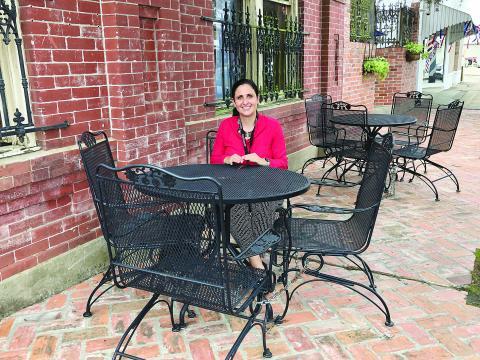 French Immersion teacher at Ville Platte Elementary Jessica Marie-Capseta is pictured as she sits in front of Cafe Evangeline after a meeting of the Rotary Club of Ville Platte. She and her family came to Ville Platte after being displaced because of Hurricane Laura.