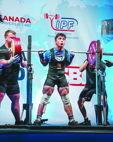 Liam Kincanon, a junior student at Sacred Heart, is pictured as he competes at the IPF/NAPF North American Regional Championships in St. John’s Newfoundland and Labrador, Canada, where he won four gold medals and set a record in squats. (Photo courtesy of Kayla Kincanon)