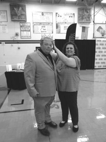 Jude Burton Jr. is crowned La. Swine Festival King by Melissa Clavier, festival association president, during the recent pageant.