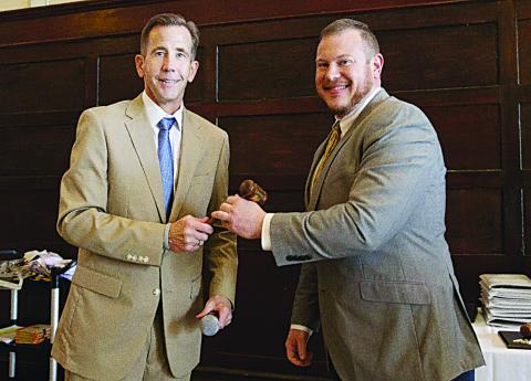 Outgoing LPA President Sam Hanna Jr. (left) ceremoniously passes the gavel to new president J. McHugh David Jr. (right). (Photo submitted)