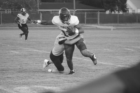 David Fontenot (11) makes a tackle on a Lafayette Renaissance Charter Academy player in a game on  Thursday night. (Gazette photo by Tony Marks)
