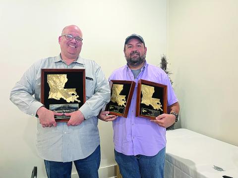 Raymond Partsch III (left) and Tony Marks (right) hold their major awards that they won at the 2025 Louisiana Sports Writers Association Awards Contest luncheon in Natchitoches on Sunday, June 28. (Photo by Tina Partsch)