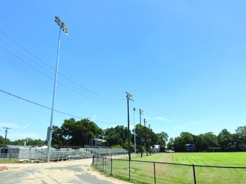 Pictured in the left and right photos are the newly installed lights at Soileau-Landry Field during the day and the night. (Photos courtesy of Kimberly Lejeune)