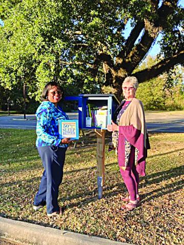 Pictured with the Little Free Library are Yvonne Lavergne, director, and Suzy Lemoine, outreach coordinator. (Photo courtesy of Suzy Lemoine)
