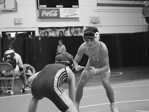 Logan Bergeron, State Champ at 106 lbs., is shown in action.