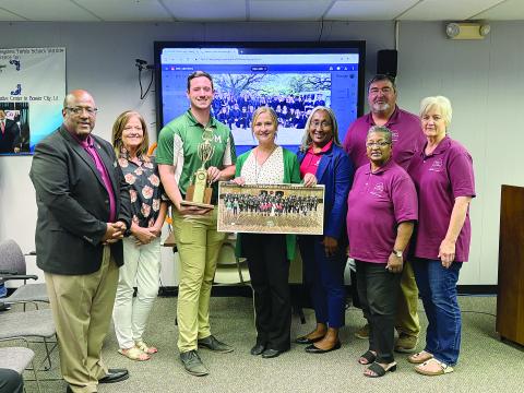 Pictured from left are back row- Evangeline Parish School Board member Mike Fontenot; front row- Superintendent Darwan Lazard, Chataignier Elementary Principal Leslie DesHotels, Mamou High band director Michael McElroy, Mamou High Principal Adrian Foret, Mamou Junior High Principal Lisa Celestine, EPSB Vice President Sheila Joseph, and EPSB member Karen Vidrine. (Gazette photo by Tony Marks)