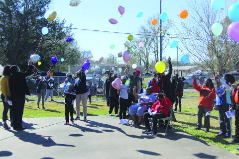 A balloon release takes place during the annual Martin Luther King Jr. Memorial Celebration held Monday, January 17, in Ville Platte. Among those pictured are Ville Platte Mayor Jennifer Vidrine, Assistant District Attorney Betsy Jackson and her mother, Beatrice, and Brian and Katrina Ardoin . (Gazette photo by Tony Marks)