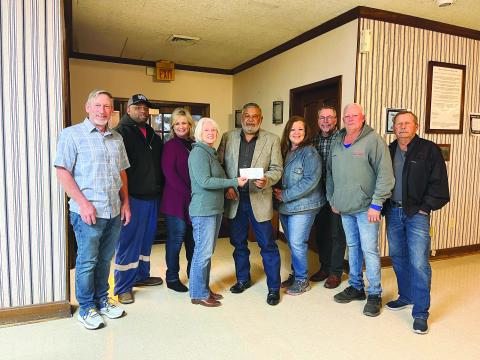 DONATION PRESENTED - Dr. Gwen Fontenot and Connie Lamke presented a donation from the Acosta Foundation to the Mamou Town Council during the board’s monthly meeting held March 9. The funds will be used for the purchase of mulch to be spread at the town’s two parks. Shown, from left, are council members Robin Young, Derrell Thomas, Leisa Deshotel, Dr. Fontenot, Mayor Ricky Fontenot, Lamke, Clerk Guy Pucheu, and council members Brook Chapman and Charles Reed. (Gazette photo by Heather Bogard)