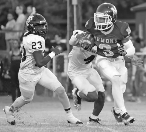 Zamurri Brown (3) sets his eyes on picking up a chunk of real estate for Mamou despite being pursued by a couple of Church Point defenders. (LSN photo by Chris Quebedeaux)