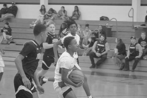 Kagien Richard (1) looks for a basket against Pine Prairie in the first game of this year’s parish tournament in Basile. (Gazette photo by Tony Marks)