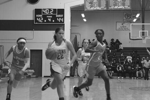Mamou’s Maddie Fontenot (22) outruns a pair of Pine Prairie defenders as the two teams play in the parish tournament held at Ville Platte High School earlier this month. (Gazette photo by Rhett Manuel)