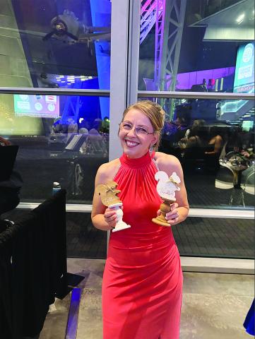 Melanie Soileau, of James Stephens Montessori, is pictured with some of her gifts at the awards gala in New Orleans. (Photo courtesy of Grace Sibley)