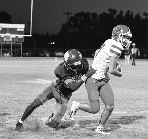 Landon Fontenot gets away from a Merryville defender. (Photo by Tonya Ortego)