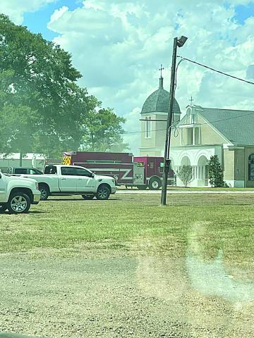 Pictured is a fire unit parked in front of Our Lady of Mount Carmel Catholic Church in Chataignier. The church sustained minor damages from an electrical fire on Sunday, September 3.  (Photo courtesy of Keith Guillory)