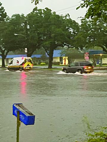 Pictured is a flooded intersection of East Main Street and LaTour Street across from Sacred Heart High School on Thursday evening. The flooding was caused by 6 to 8.5 inches of rain that fell on the area from Tropical Storm Nicholas. (Photo courtesy of Suzy Lemoine)