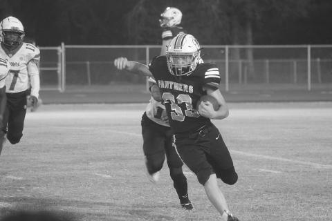 In Pine Prairie’s home opener, a 46-0 loss to North Central, Rhett Guillory (33) finds an open running lane for positive yardage. (Gazette photo by Tony Marks)