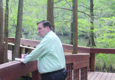 This picture of Lieutenant Governor Billy Nungesser jotting down ideas while peering over Lake Chicot from the pier located near the group cabins of Chicot Park earned Ville Platte Gazette editor Tony Marks a first place award in Best News Photo in the 2023 Better Newspaper Competition. (Gazette file photo)