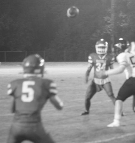 Christian Guillory (34) looks to complete a pass to Landon Johnson (5) during Basile’s win over Oberlin. (Gazette photo by Tony Marks)