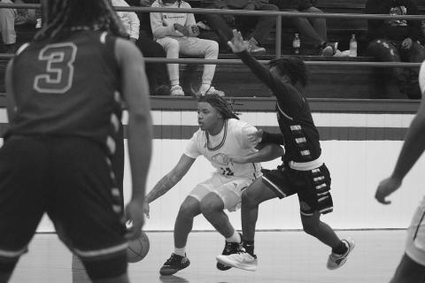 While Latelldrick Prejean (3) looks, Latravion Thomas (0) tries to keep pace with Oakdale’s Derrick Green (12) during the Oakdale Tournament on Friday, January 5. (LSN photo by Tony Marks)