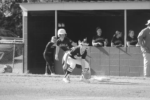 Sacred Heart’s Emily Ardoin (10) holds Oakdale’s Aldyn Hebert (17) on the first base bag. (LSN photo by Tony Marks)