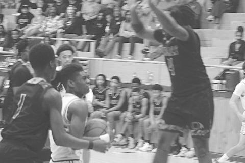 Oakdale’s Brandon Baker Guidry (4) goes up to block a shot from Mamou’s Jamison Viltz in Oakdale’s 74-52 loss last Friday night. (Gazette photo by Tony Marks)