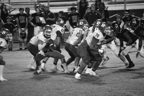 The Basile Bearcat offensive line stands tall against Oberlin while Jackson Courville makes his move at quarterback. (Photo by Rachel Manuel)