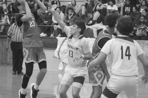 Wes Matt (23) gets off a basket for Basile as he is being guarded by Oberlin’s Kole Sonnier (13). (Gazette photo by Tony Marks)